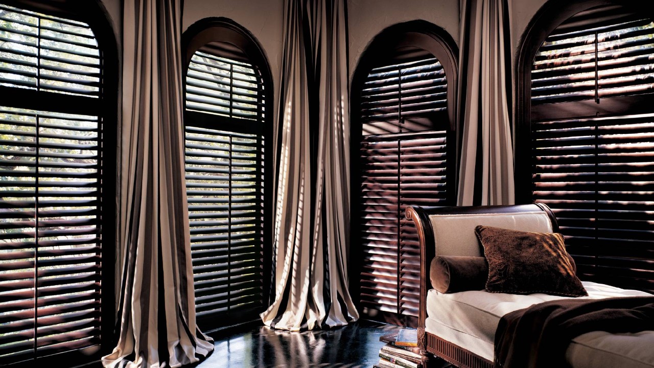 Hunter Douglas arched window shutters in a living room near Norwalk, CT