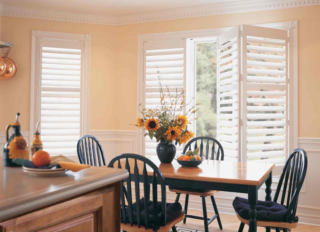 White Hunter Douglas shutters in a peach-colored kitchen near Norwalk, CT